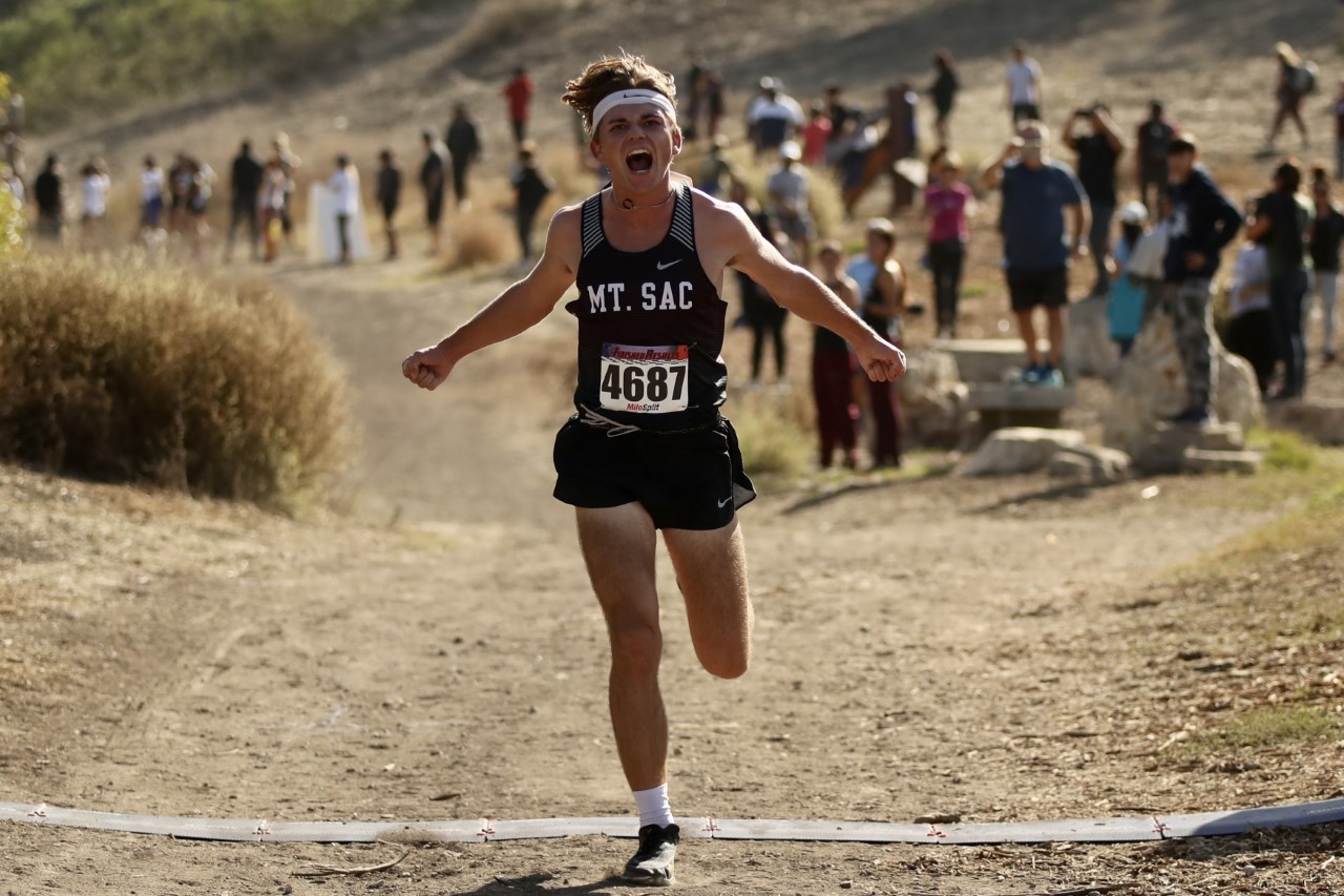 Mt. SAC's Austin Ledgerwood crosses the finish line as the Mounties win their ninth straight SCC men's cross country tilte (photo by Michael Watkins).