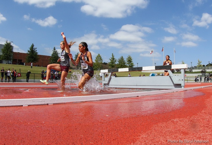 Mt. SAC's Kaitlyn Atkinson (left) and Karla Galvan splash through the 3,000 steeplechase at the state meet on Saturday (photo by Daryl Peterson for CCCAA).